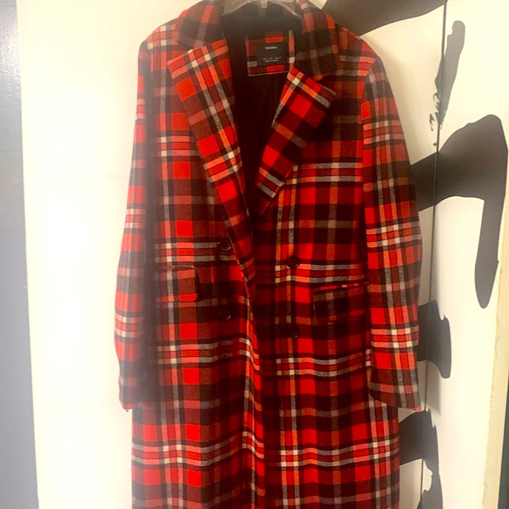 A red coat with dark blue lines
